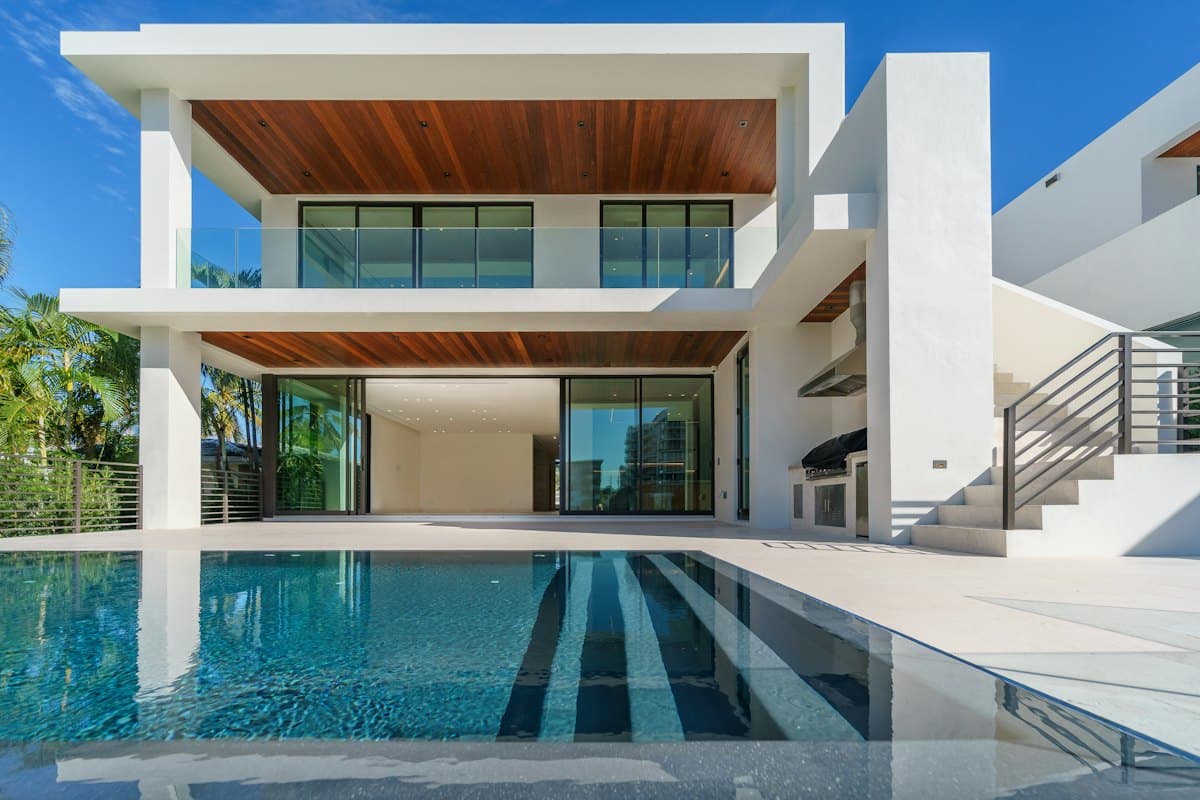 Modern villa with a timber ceiling and a reflecting pool